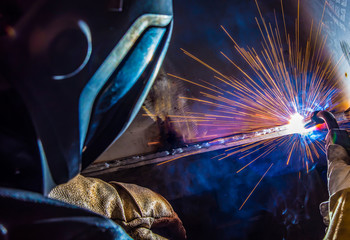 Fototapeta na wymiar Industrial steel welder in factory