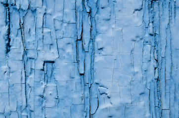 blue paint covers the wood