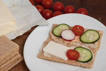 Whole grain healthy crunchy cereal bread with cheese and vegetables