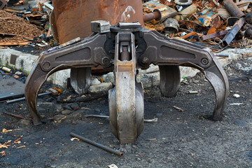 Clamshell bucket in the metal warehouse