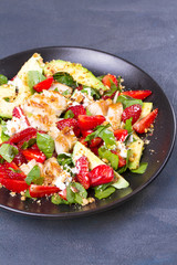 Strawberry, avocado, spinach salad with chicken
