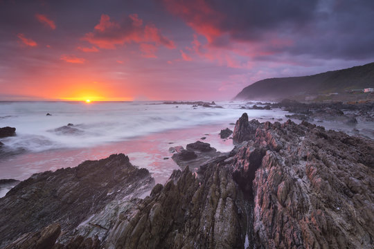 Sunset over the ocean in Garden Route NP, South Africa