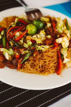 Tasty stir fry rice noodle with meat and vegetables, Asian food celebration