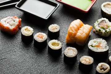 Traditional japanese cuisine sushi on black table