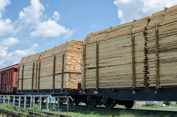 Full train cars loaded with timber