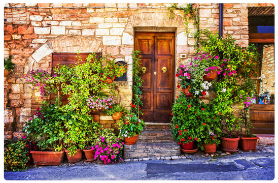 Fototapeta Charming floral decorated streets of medieval towns of Italy. Spello in Umbria