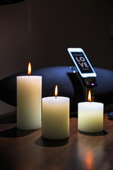 burning candles in the interior highlight the music center