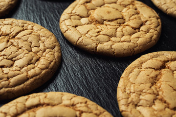 Biscuit sweet cookie background. Domestic stacked butter biscuit pattern concept,close up macro.Homemade cookies on wooden table.Cereal biscuits with the sesame,peanuts,sunflower and amaranth.