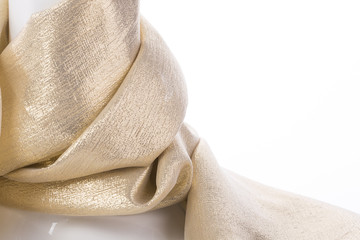 Scarf made of silk in gold color on a mannequin