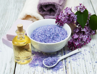 Fototapeta na wymiar Spa salt and oil with lilac flowers