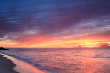Fototapeta na wymiar Panorama of beautiful sunset on the aegean sea in greek Island.