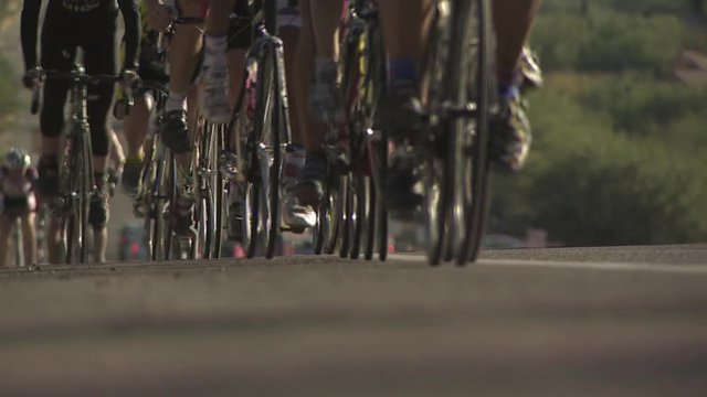 View of Cyclists Legs and Tires 2