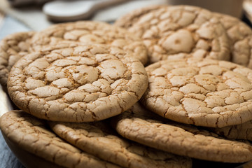 Biscuit sweet cookie background. Domestic stacked butter biscuit pattern concept,close up macro.Homemade cookies on wooden table.Cereal biscuits with the sesame,peanuts,sunflower and amaranth.