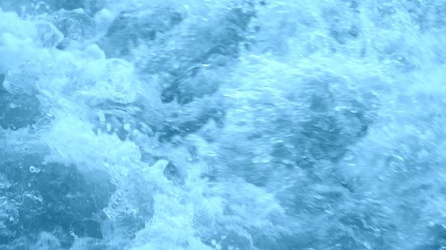 Water splash background. Blue stream. Slow motion 180 fsp
