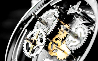concept hour metal gears on dark background top view