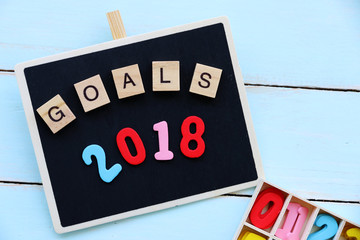 GOALS 2018 text on blackboard on blue table