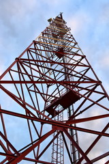 communications tower cell mobile with equipment with blue sky background