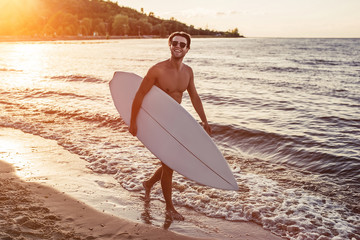 Young man with surfboard
