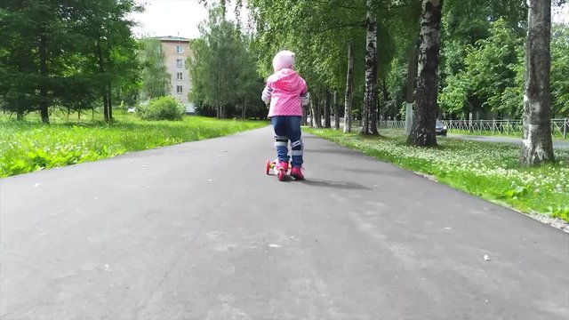 HD video little girl riding scooter