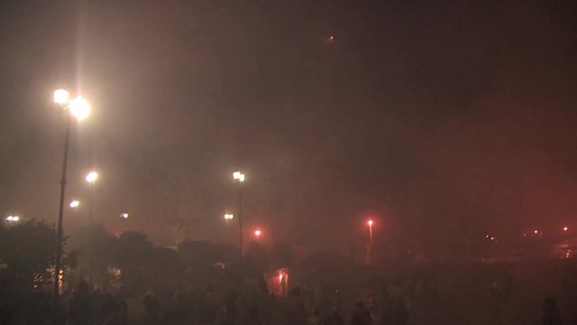 Torito shoots out fireworks into the crowd shot from up above the crowed