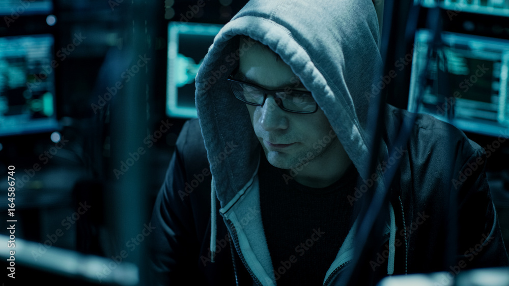 Aufkleber Dangerous Hooded Hacker Breaks into Government Data Servers and Infects Their System with a Virus. His Hideout Place has Dark Atmosphere, Multiple Displays, Cables Everywhere.