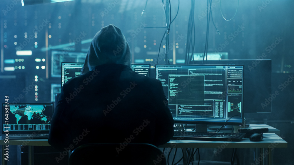 Aufkleber Dangerous Hooded Hacker Breaks into Government Data Servers and Infects Their System with a Virus. His Hideout Place has Dark Atmosphere, Multiple Displays, Cables Everywhere.