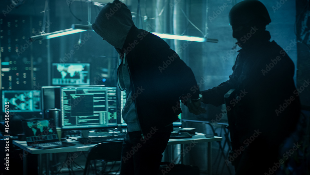 Poster fully armed special cybersecurity forces soldier arrests and handcuffs highly dangerous hacker. hide