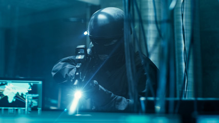 Cyber War Special Forces Fully Armed Soldier Uncovers Internationally Wanted Hacker's Hideout Place. Lair is Full of Monitors, Cables and Has Neon Lights.