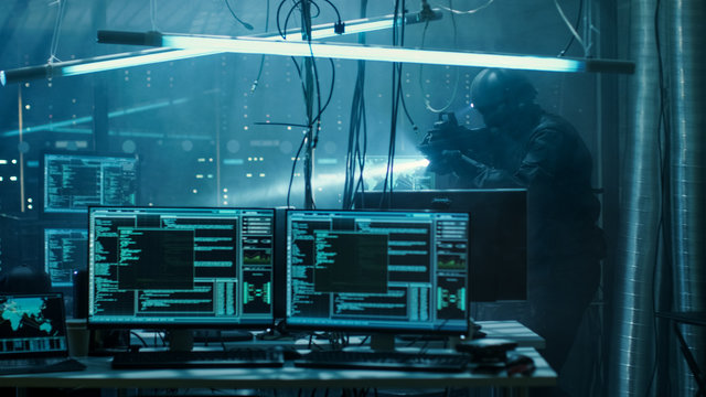 Cyber War Special Forces Fully Armed Soldier Uncovers Internationally Wanted Hacker's Hideout Place. Lair is Full of Monitors, Cables and Has Neon Lights.
