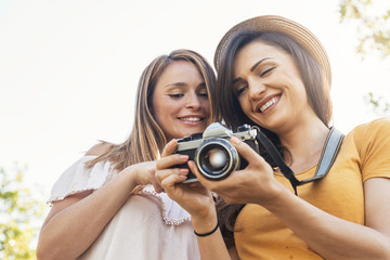 Photographer showing a picture to her friend.