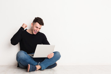 Successful man freelancer in casual with laptop