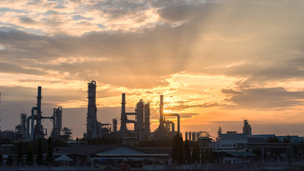 Obraz na płótnie Canvas Gas turbine electrical power plant at dusk with orange sky,industrial