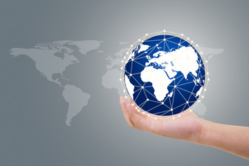 Businessman holding digital tactile world interface with hand communication network concept, Elements of this image furnished by NASA.