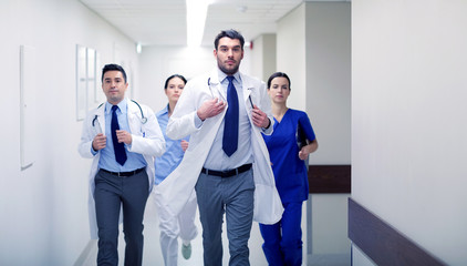 group of medics walking along hospital