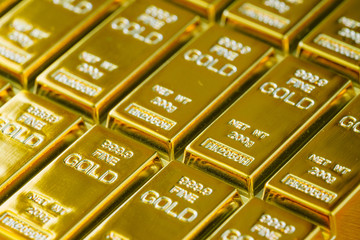 selective focus on  shiny gold bars as financial investment and wealth concept