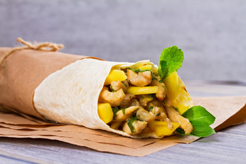 Chicken, mango, cheese, basil and mint burritos.  Wraps with chicken