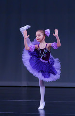 Little girl dancing ballet Coppelia variation on stage
