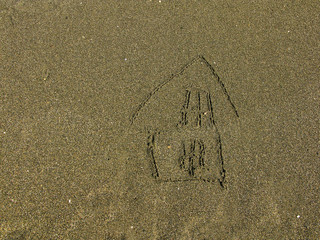 House painted on beach sand