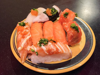 many sushi on the yellow dish