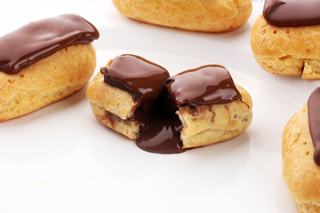 Traditional French dessert. Eclair with chocolate icing. Pastery concept