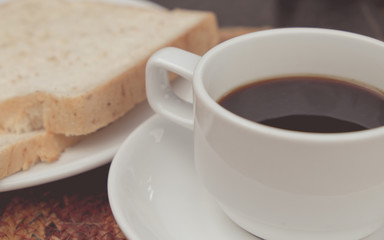 Black coffee in morning time. (vintage tone)