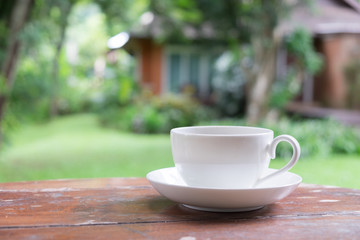 White coffee cup in the garden.
