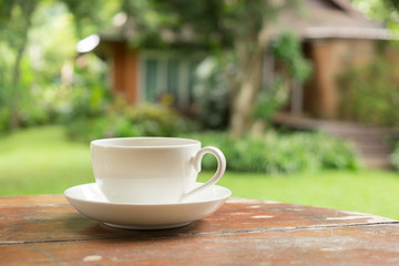 White coffee cup in the garden.