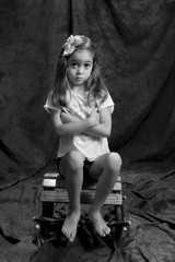 young girl posing in the studio in black & white 