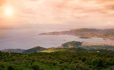 Fototapeta premium Panorama of the Greek city of Volos at sunset. Volos Greece. View from the mountain on the Volos