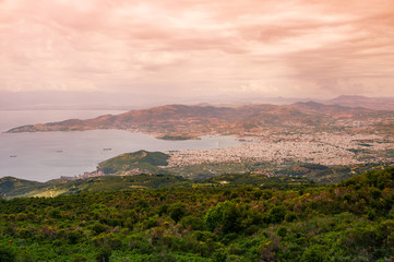 Fototapeta na wymiar Panorama of the Greek city of Volos at sunset. Volos Greece. View from the mountain on the Volos
