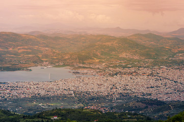 Fototapeta premium Panorama of the Greek city of Volos at sunset. Volos Greece. View from the mountain on the Volos