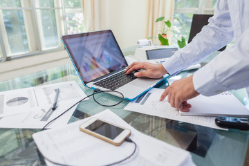 Fototapeta premium Business man working on open laptop at home office
