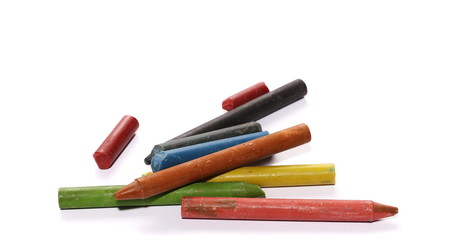 Grunge wax pastel crayons and drawings isolated on white background