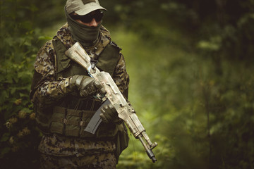 Soldier in camouflage wearing helmet